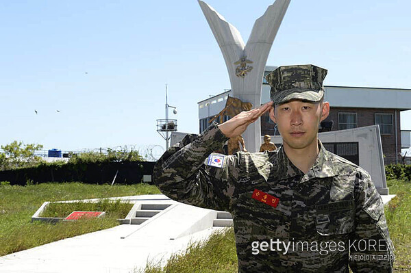 Tottenham Hotspur forward Son Heung-min takes part in a military drill at a Marine Corps / Getty Images