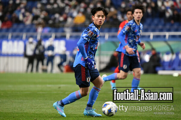 SAITAMA, JAPAN - JANUARY 27: Takefusa Kubo of Japan in action during the FIFA World Cup Asian Qualifier Final Round Group B match between Japan and China at Saitama Stadium on January 27, 2022 in Saitama, Japan. (Photo by Kenta Harada/Getty Images)