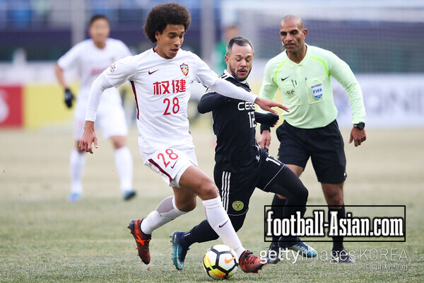 TIANJIN, CHINA - JANUARY 30: Axel Witsel #28 of Tianjin Quanjian competes the ball with Stephan Markus Schrock of Ceres-Negros during the 2018 AFC Champions League qualifying match between Tianjin Quanjian and Ceres-Negros at Tianjin Olympic Center Stadium on January 30, 2018 in Tianjin, China. (Photo by Lintao Zhang/Getty Images)