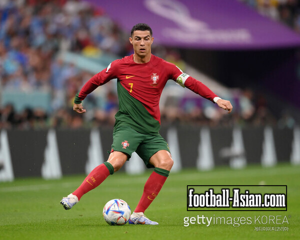 Cristiano Ronaldo of Portugal runs with the ball during the FIFA World Cup Qatar 2022 Group H match between Portugal and Uruguay at Lusail Stadium on November 28, 2022 in Lusail City, Qatar. (Photo by Laurence Griffiths/Getty Images)