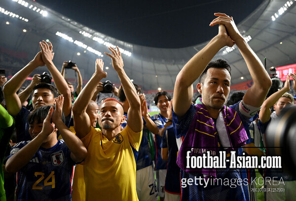 Maya Yoshida of Japan applauds fans after the 2-1 win and qualifying for the knockout stages during the FIFA World Cup Qatar 2022 Group E match between Japan and Spain at Khalifa International Stadium on December 01, 2022 in Doha, Qatar. (Photo by Clive Mason/Getty Images)