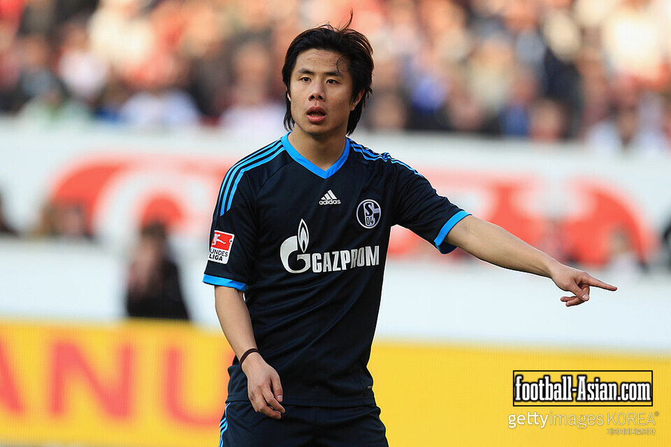 STUTTGART, GERMANY - MARCH 05: Junmin Hao of Schalke gestures during the Bundesliga match between VfB Stuttgart and FC Schalke 04 at Mercedes-Benz Arena on March 5, 2011 in Stuttgart, Germany. (Photo by Alex Grimm/Bongarts/Getty Images)
