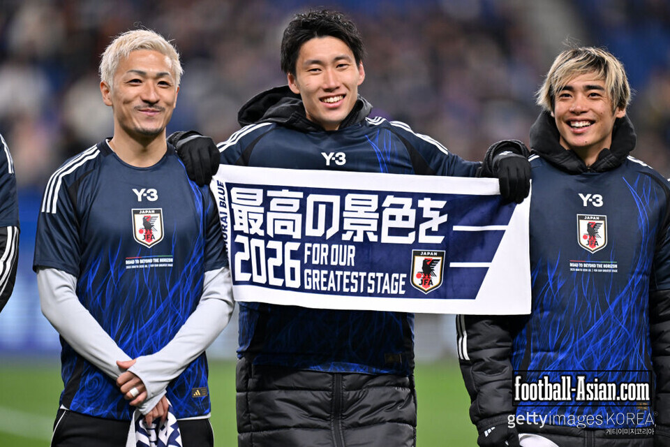 SAITAMA, JAPAN - MARCH 20: (L-R) Daizen Maeda, Daichi Kamada and Junya Ito of Japan celebrate qualifying for the 2026 FIFA World Cup following the 2-0 victory after the FIFA World Cup Asian qualifier Group C match between Japan and Bahrain at Saitama Stadium on March 20, 2025 in Saitama, Japan. (Photo by Kenta Harada/Getty Images)