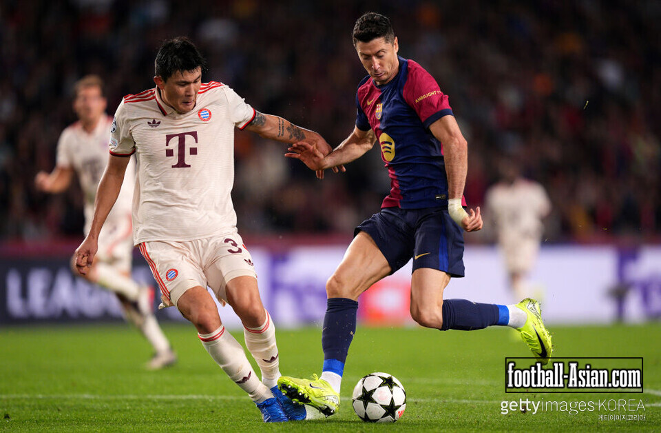 BARCELONA, SPAIN - OCTOBER 23: Robert Lewandowski of FC Barcelona battles for possession with Kim Min-Jae of Bayern Munich during the UEFA Champions League 2024/25 League Phase MD3 match between FC Barcelona and FC Bayern Munchen at Estadi Olimpic Lluis Companys on October 23, 2024 in Barcelona, Spain. (Photo by Pedro Salado/Getty Images)
