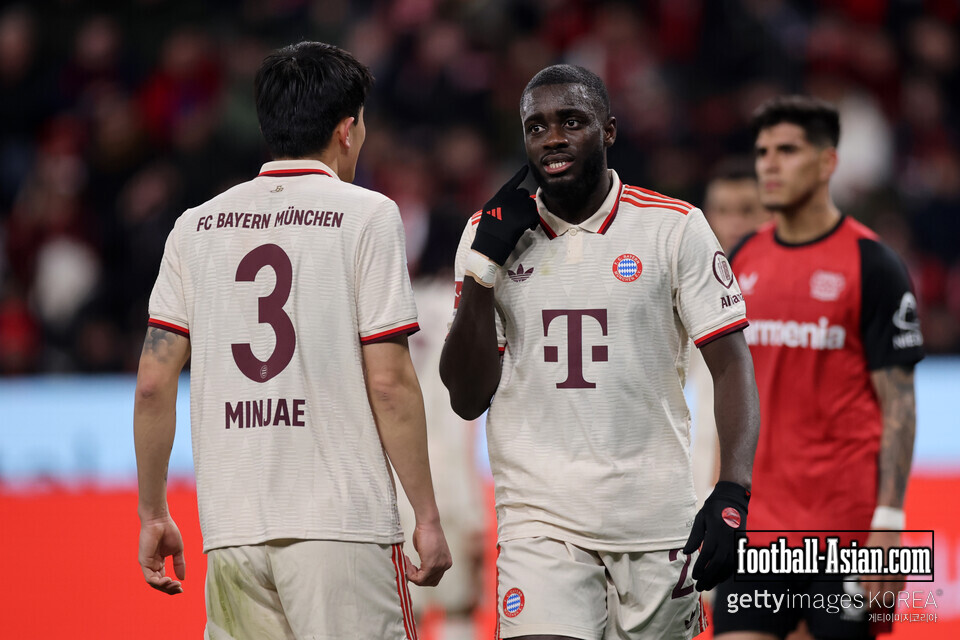 LEVERKUSEN, GERMANY - FEBRUARY 15: Kim Min-Jae and Dayot Upamecano of Bayern Munich talk on the pitch during the Bundesliga match between Bayer 04 Leverkusen and FC Bayern München at BayArena on February 15, 2025 in Leverkusen, Germany. (Photo by Alex Grimm/Getty Images)