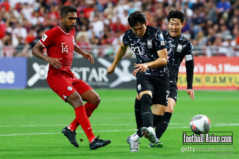 SINGAPORE, SINGAPORE - JUNE 06: Bae Jun-ho #23 of South Korea scores his team's sixth goal in the second half against Singapore during the FIFA World Cup Asian 2nd qualifier match at the National Stadium on June 06, 2024 in Singapore. (Photo by Yong Teck Lim/Getty Images)