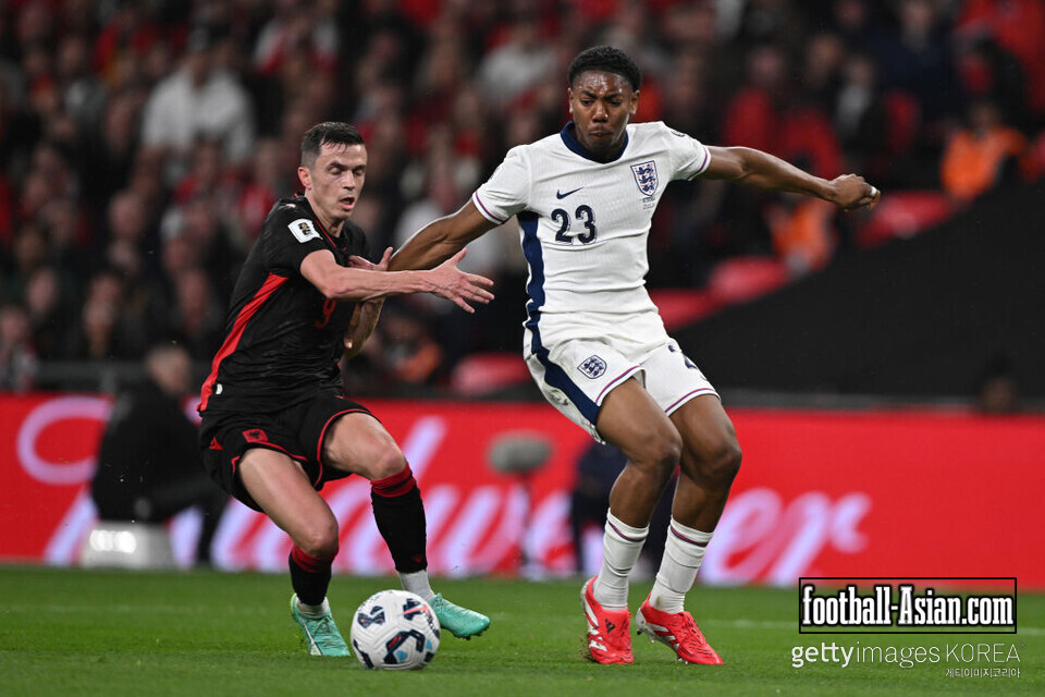 LONDON, ENGLAND - MARCH 21: Myles Lewis-Skelly of England shrugs off the challenge of Jasir Asani of Albania and goes on to score during the FIFA World Cup 2026 European Qualifier between England and Albania at Wembley Stadium on March 21, 2025 in London, England. (Photo by Mike Hewitt/Getty Images)