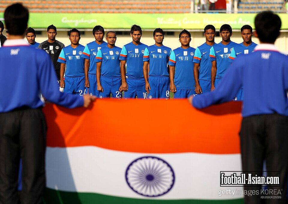 GUANGZHOU, CHINA - NOVEMBER 09: The India team sing their national anthem prior to kickoff during the Men's Football group D pool match between Qatar and India ahead of the 16th Asian Games Guangzhou 2010 at Huadu Stadium on November 9, 2010 in Guangzhou, China. (Photo by Richard Heathcote/Getty Images)