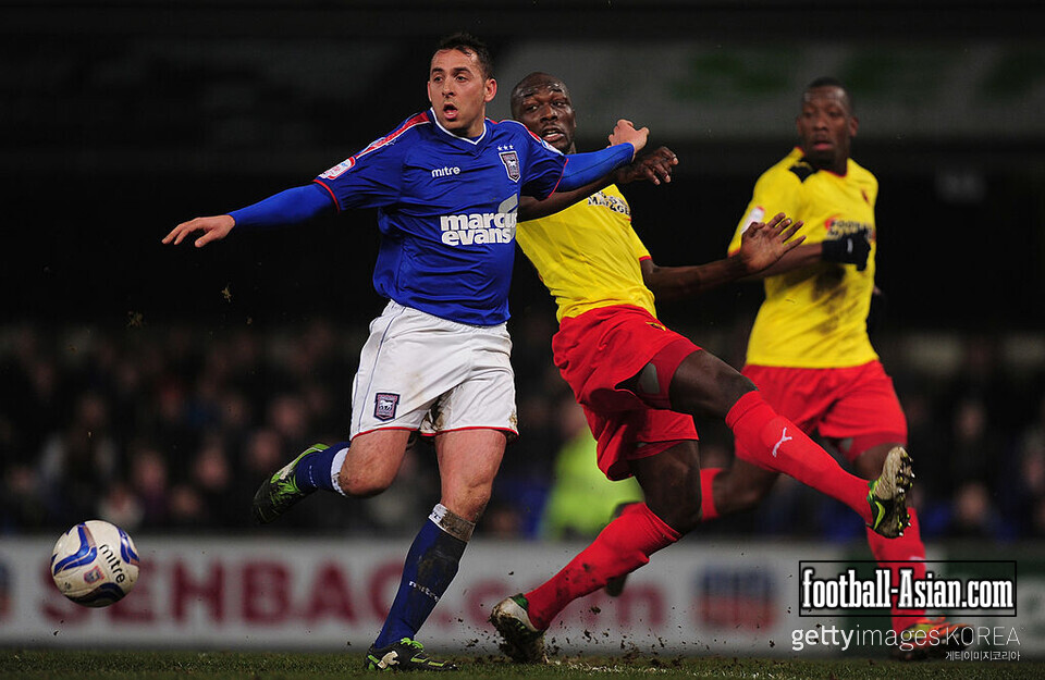 IPSWICH, ENGLAND - FEBRUARY 19: Michael Chopra of Ipswich Town battles with Lloyd Doyley of Watford during the npower Championship match between Ipswich Town and Watford at Portman Road on February 19, 2013 in Ipswich, England. (Photo by Jamie McDonald/Getty Images)