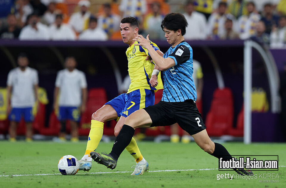 JEDDAH, SAUDI ARABIA - APRIL 30: Cristiano Ronaldo of Al Nassr is challenged by Kota Takai of Kawasaki Frontale during the AFC Champions League Elite Semi Final between Al Nassr and Kawasaki Frontale at King Abdullah Sports City Hall Stadium on April 30, 2025 in Jeddah, Saudi Arabia. (Photo by Yasser Bakhsh/Getty Images)