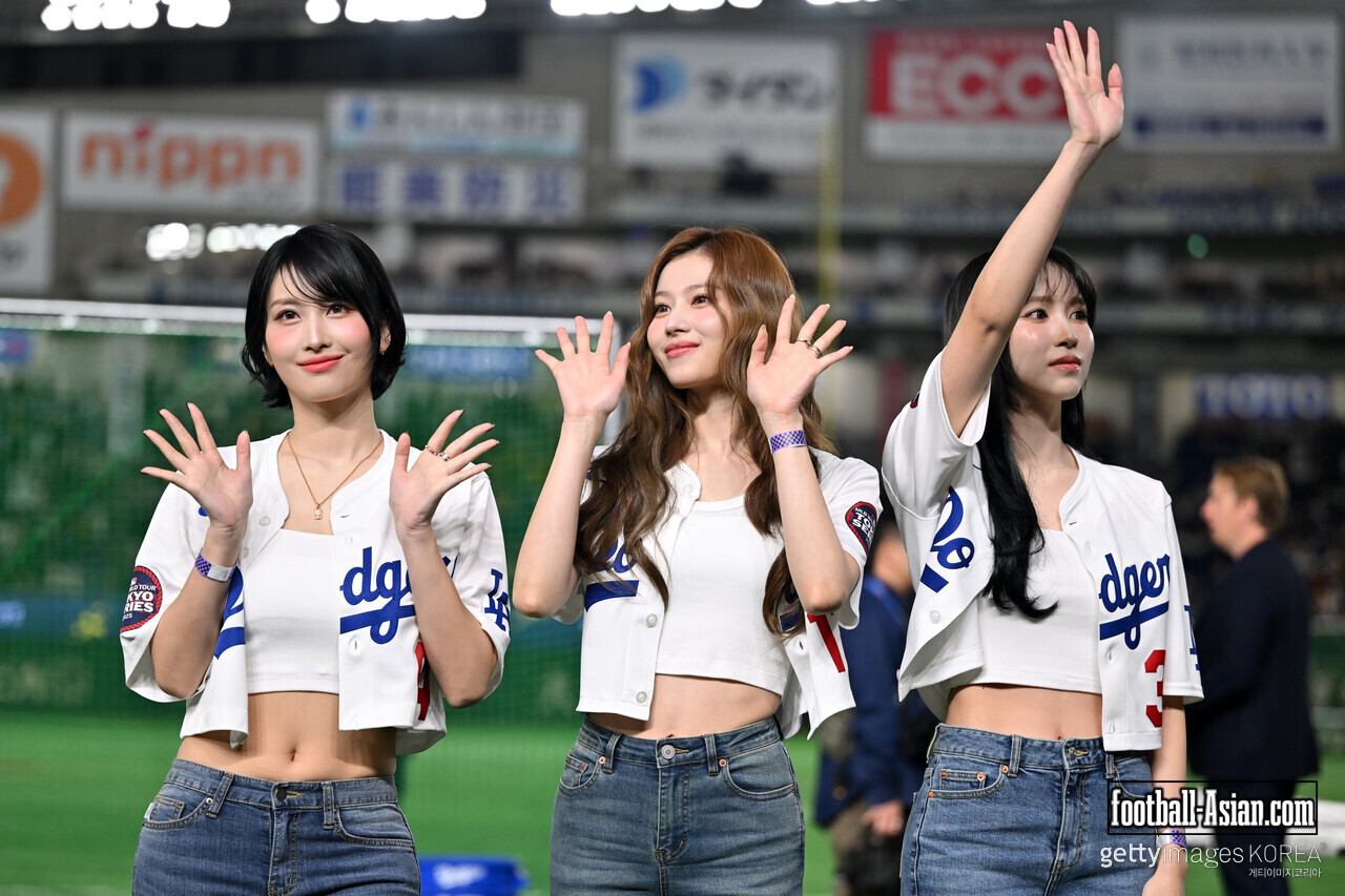 TOKYO, JAPAN - MARCH 16: (L-R) Momo, Sana and Mina of girl group MiSaMo, subunit of Korean idol group TWICE pose during the game between Los Angeles Dodgers and Hanshin Tigers at Tokyo Dome on March 16, 2025 in Tokyo, Japan. (Photo by Kenta Harada/Getty Images)