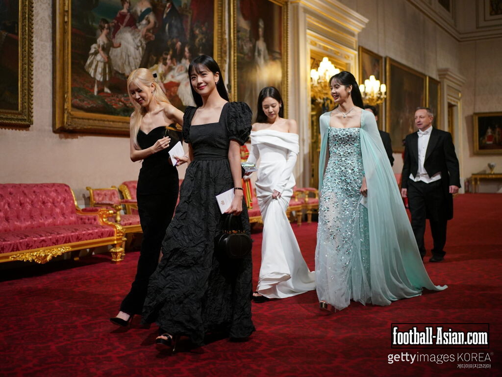 LONDON, ENGLAND - NOVEMBER 22: (left to right) Lisa (Lalisa Manoban), Rose (Roseanne Park), Jisoo Kim and Jennie Kim, from the K-Pop band Blackpink pose with their Honorary MBEs (Members of the Order of the British Empire), awarded to them in recognition of the band's role as COP26 advocates for the COP26 Summit in Glasgow 2021 on November 22, 2023 in London, England. King Charles III conducted the special Investiture ceremony in the presence of the President of South Korea, Yoon Suk Yeol, and his wife, Kim Keon Hee. (Photo by Victoria Jones - Pool/Getty Images)