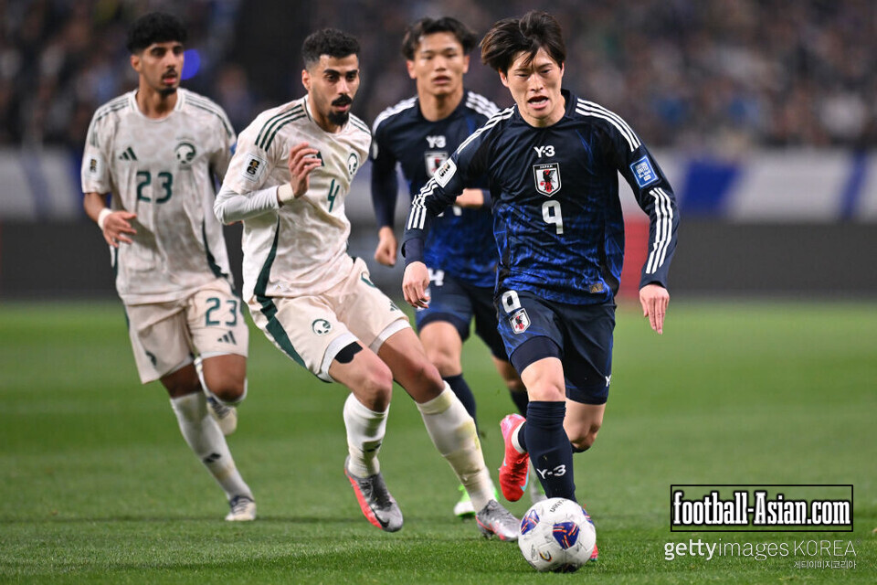 SAITAMA, JAPAN - MARCH 25: Kyogo Furuhashi of Japan controls the ball against Ali Lajami of Saudi Arabia during the FIFA World Cup qualifier Asian third round Group C match between Japan and Saudi Arabia at Saitama Stadium on March 25, 2025 in Saitama, Japan. (Photo by Kenta Harada/Getty Images)