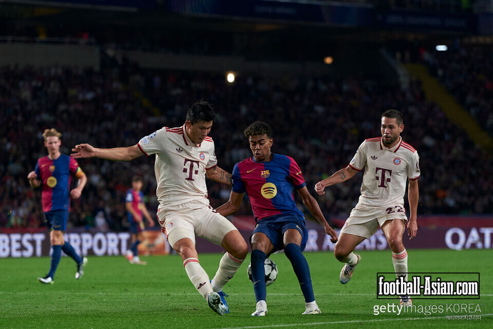 BARCELONA, SPAIN - OCTOBER 23: Lamine Yamal of FC Barcelona competes for the ball with Minjae Kim and Raphael Guerreiro of FC Bayern Munchen during the UEFA Champions League 2024/25 League Phase MD3 match between FC Barcelona and FC Bayern Munchen at Estadi Olimpic Lluis Companys on October 23, 2024 in Barcelona, Spain. (Photo by Pedro Salado/Getty Images)