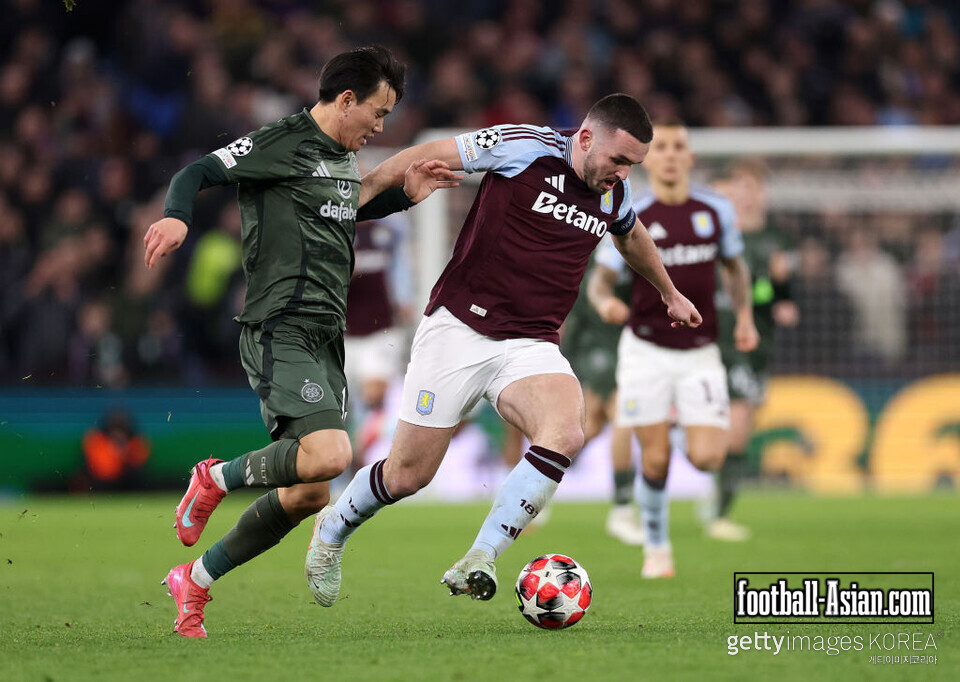 BIRMINGHAM, ENGLAND - JANUARY 29: Yang Hyun-Jun of Celtic battles for possession with John McGinn of Aston Villa during the UEFA Champions League 2024/25 League Phase MD8 match between Aston Villa FC and Celtic FC at Villa Park on January 29, 2025 in Birmingham, England. (Photo by Julian Finney/Getty Images)