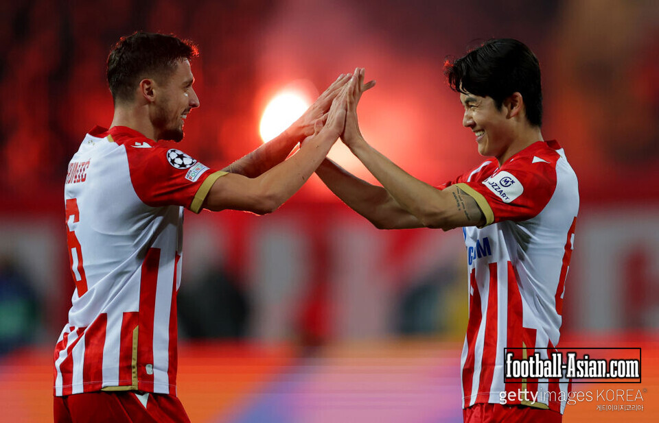BELGRADE, SERBIA - NOVEMBER 27: Rade Krunic and Seol Young-woo of Crvena Zvezda celebrate a goal during the UEFA Champions League 2024/25 League Phase MD5 match between FK Crvena Zvezda and VfB Stuttgart at Stadion Rajko Mitic on November 27, 2024 in Belgrade, Serbia. (Photo by Srdjan Stevanovic/Getty Images)