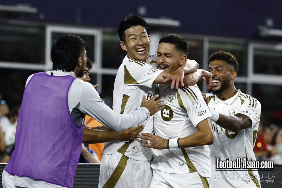 FOXBOROUGH, MASSACHUSETTS - AUGUST 16: Mark Delgado #8 of Los Angeles FC celebrates after scoring the team's first goal with teammates Son Heung-Min #7 and Denis Bouanga #99 during the MLS match between New England Revolution and Los Angeles Football Club at Gillette Stadium on August 16, 2025 in Foxborough, Massachusetts. (Photo by Winslow Townson/Getty Images)