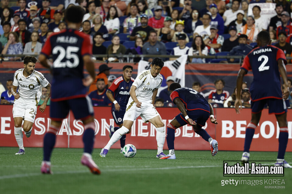 FOXBOROUGH, MASSACHUSETTS - AUGUST 16: Son Heung-Min #7 of Los Angeles FC controls the ball whilst under pressure from Brayan Ceballos #3 of the New England Revolution during the MLS match between New England Revolution and Los Angeles Football Club at Gillette Stadium on August 16, 2025 in Foxborough, Massachusetts. (Photo by Winslow Townson/Getty Images)
